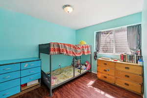 Bedroom featuring dark wood finished floors