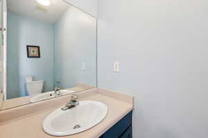 Bathroom featuring vanity and toilet