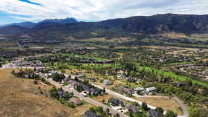 View of property location featuring a mountainous background and nearby suburban area