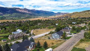 Aerial perspective of suburban area with a mountain backdrop
