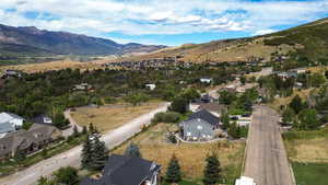 Aerial view of residential area featuring a mountainous background