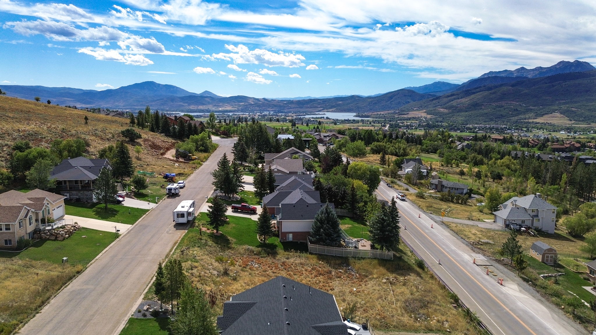 Aerial perspective of suburban area with a mountainous background