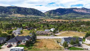 Aerial perspective of suburban area featuring a mountainous background