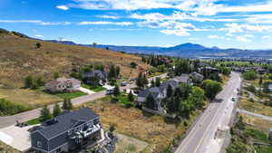 Aerial perspective of suburban area with a mountainous background