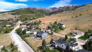 Aerial view of residential area featuring a mountain backdrop