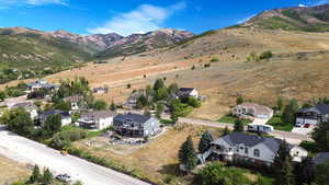Aerial perspective of suburban area with a mountain backdrop