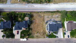 Aerial view of property's location with nearby suburban area