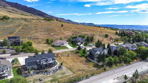 Aerial view of residential area featuring a mountain backdrop