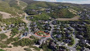 Aerial view of property and surrounding area with property boundaries highlighted - Overhead with views of surrounding subdivision