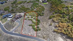 Aerial view of sparsely populated area featuring property parcel outlined