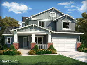 Craftsman inspired home with brick siding, covered porch, and board and batten siding