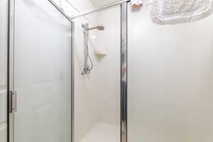 Full bath featuring a stall shower