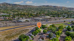 Aerial overview of property's location featuring a mountain backdrop