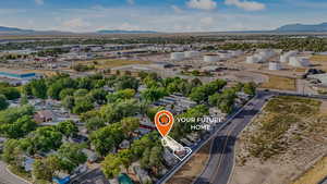 Aerial perspective of suburban area with a mountain backdrop