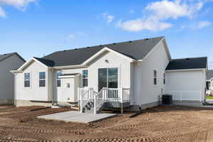 View of front of house featuring stucco siding and a shingled roof