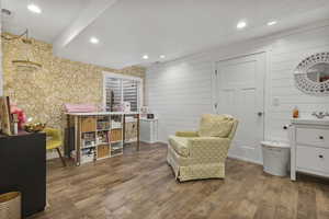 Living area with recessed lighting and wood finished floors