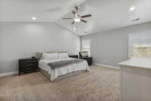 Bedroom featuring light carpet, vaulted ceiling, ceiling fan, and recessed lighting