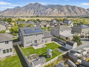 Aerial perspective of suburban area with a mountainous background
