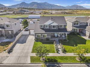 Aerial perspective of suburban area featuring a mountain backdrop
