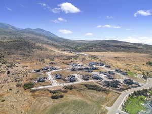 Aerial overview of property's location with a mountain backdrop