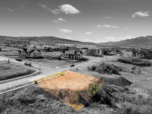 View of mountain backdrop featuring nearby suburban area