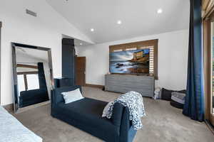 Bedroom featuring recessed lighting, carpet flooring, and high vaulted ceiling