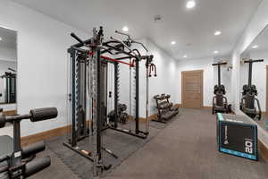 Exercise area featuring recessed lighting and baseboards
