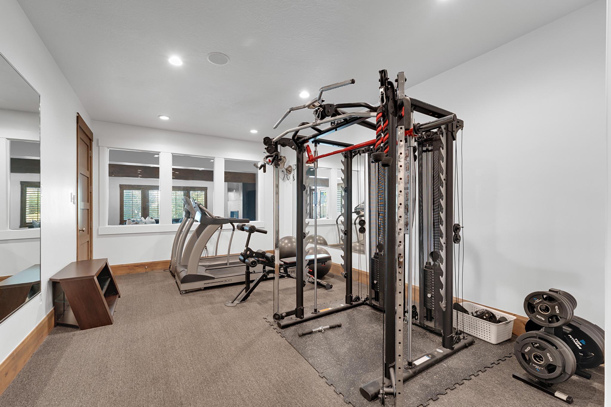Workout area with recessed lighting and baseboards