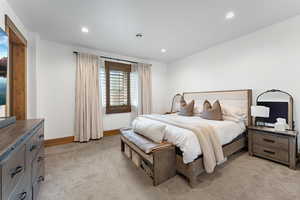 Bedroom featuring light carpet and recessed lighting