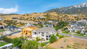 Aerial view of residential area featuring a mountain backdrop