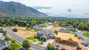 Aerial perspective of suburban area featuring a mountain backdrop