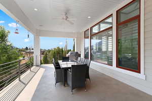 View of patio with a ceiling fan, outdoor dining area, and a grill
