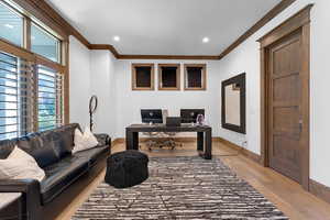 Office area featuring ornamental molding, recessed lighting, and light wood-style floors