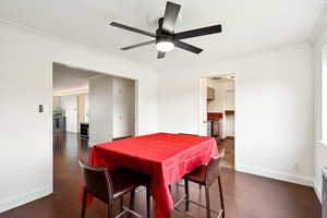 Dining area featuring crown molding and ceiling fan