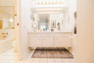 Master bath featuring vanity and a garden tub