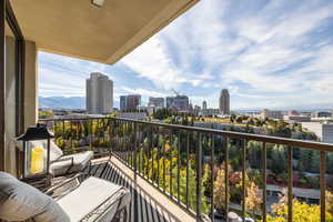 Balcony featuring a skyline view