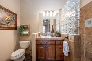 Bathroom featuring vanity and ceiling fan