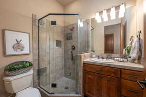 Full bath with vanity and a stall shower