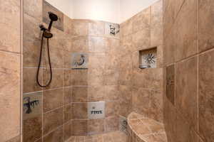 Full bath with tiled shower