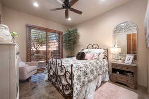 Bedroom with a ceiling fan and recessed lighting