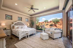 Bedroom featuring a tray ceiling, a ceiling fan, recessed lighting, and access to outside