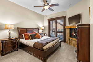 Bedroom with stone fireplace
