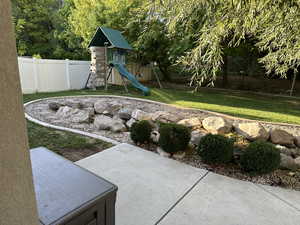 View of yard featuring a playground