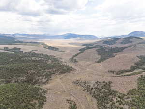 View of mountain backdrop with rural landscape
