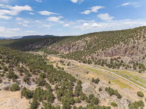View of mountain background featuring rural landscape