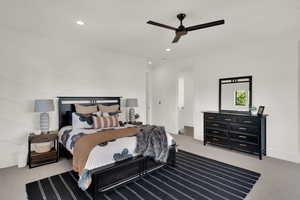 Bedroom with light colored carpet, recessed lighting, and a ceiling fan