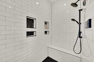 Full bath with a tile shower