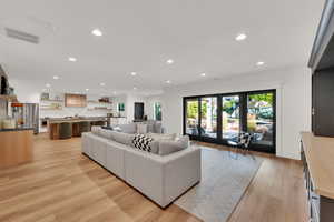 Living area featuring recessed lighting and light wood-style floors