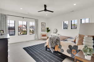 Carpeted bedroom featuring recessed lighting and ceiling fan