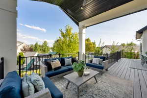 Deck featuring an outdoor hangout area and a patio
